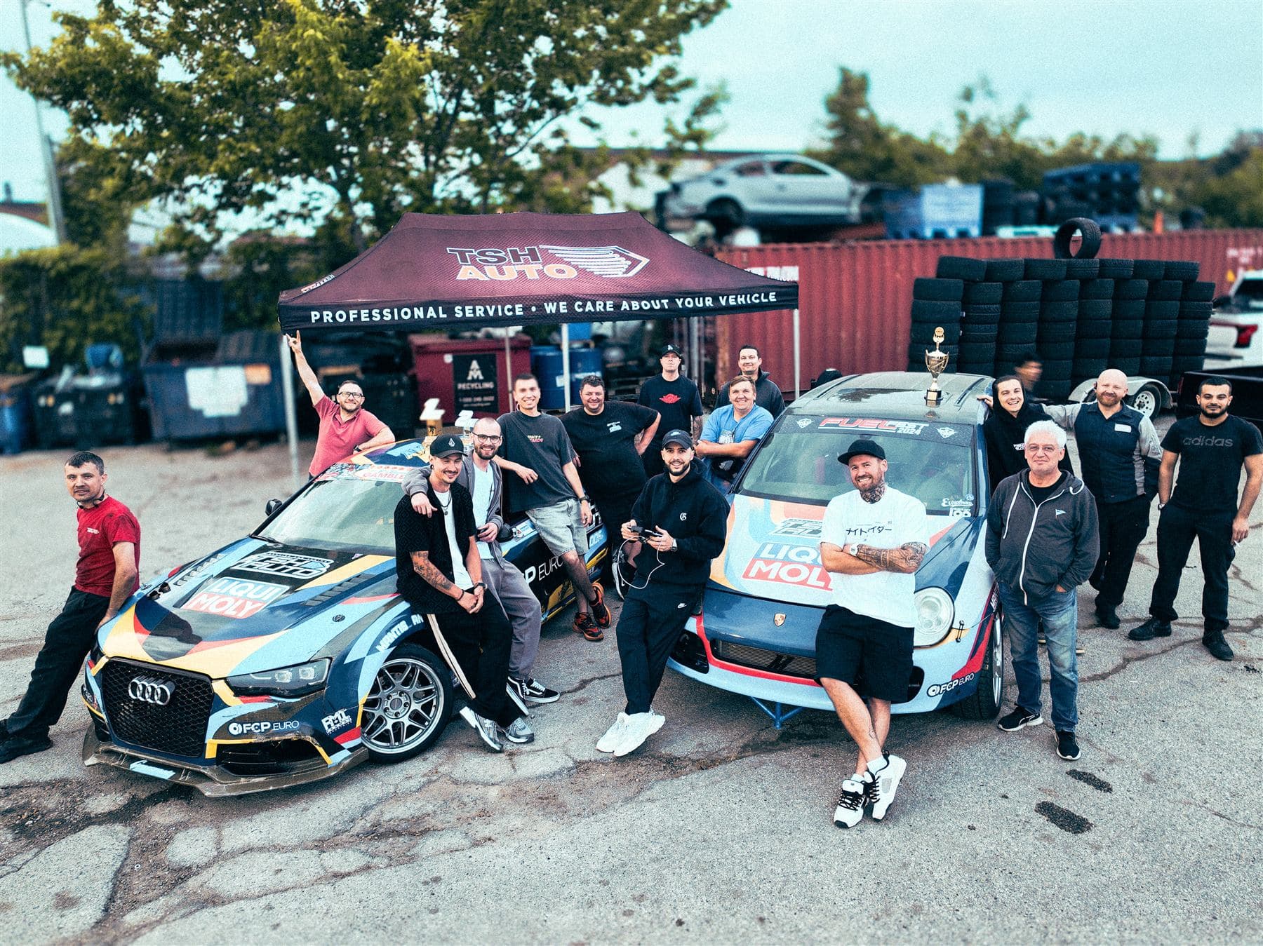 TSH Auto staff and race team with the two competition cars