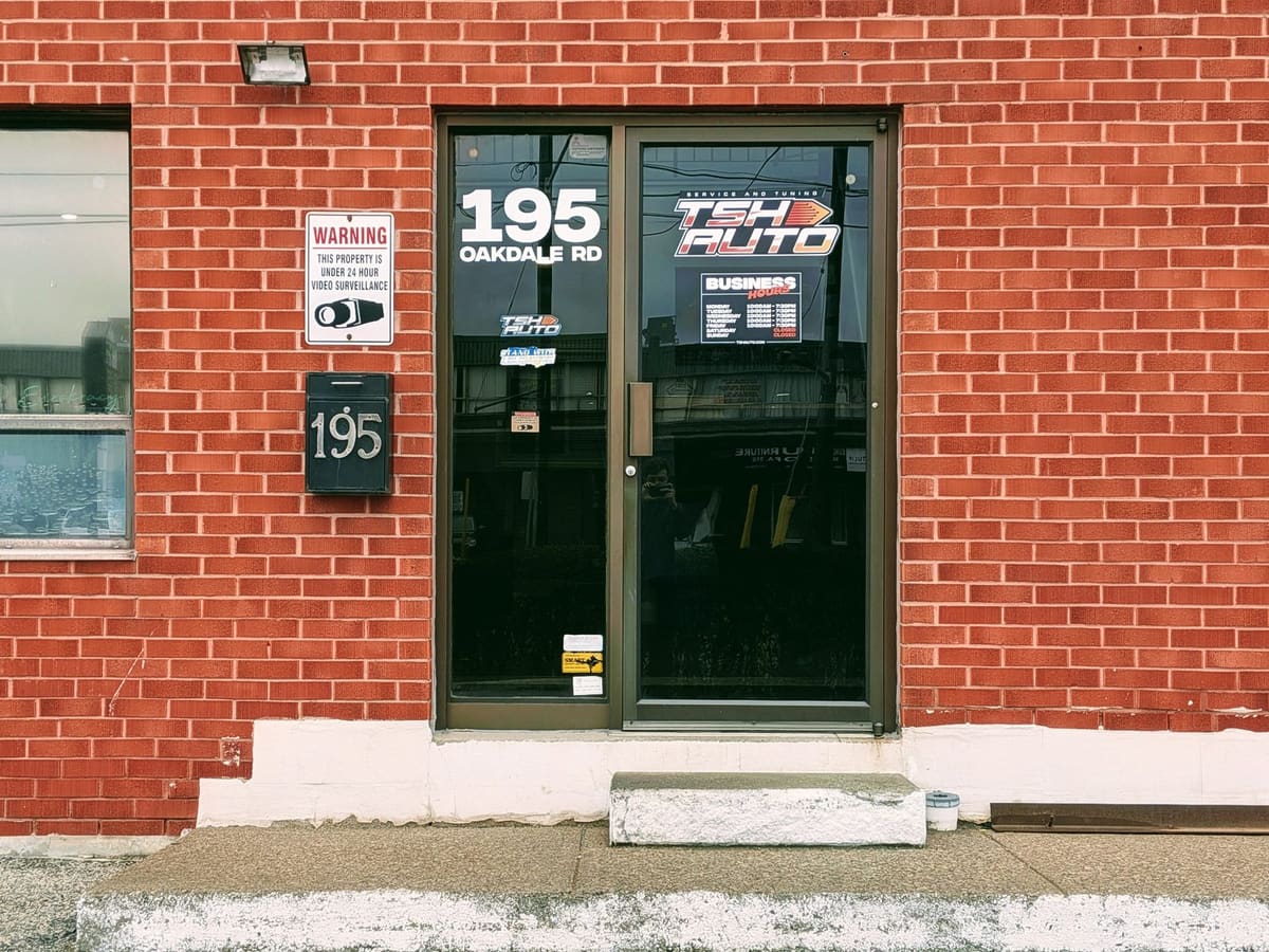 The customer door at 195 Oakdale Rd, marked with the TSH Auto sign